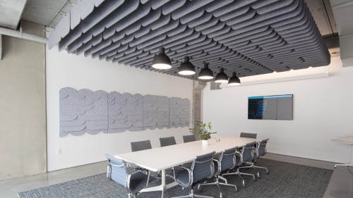 A conference setting showing Loftwall Tempo acoustical panels for ceiling and wall